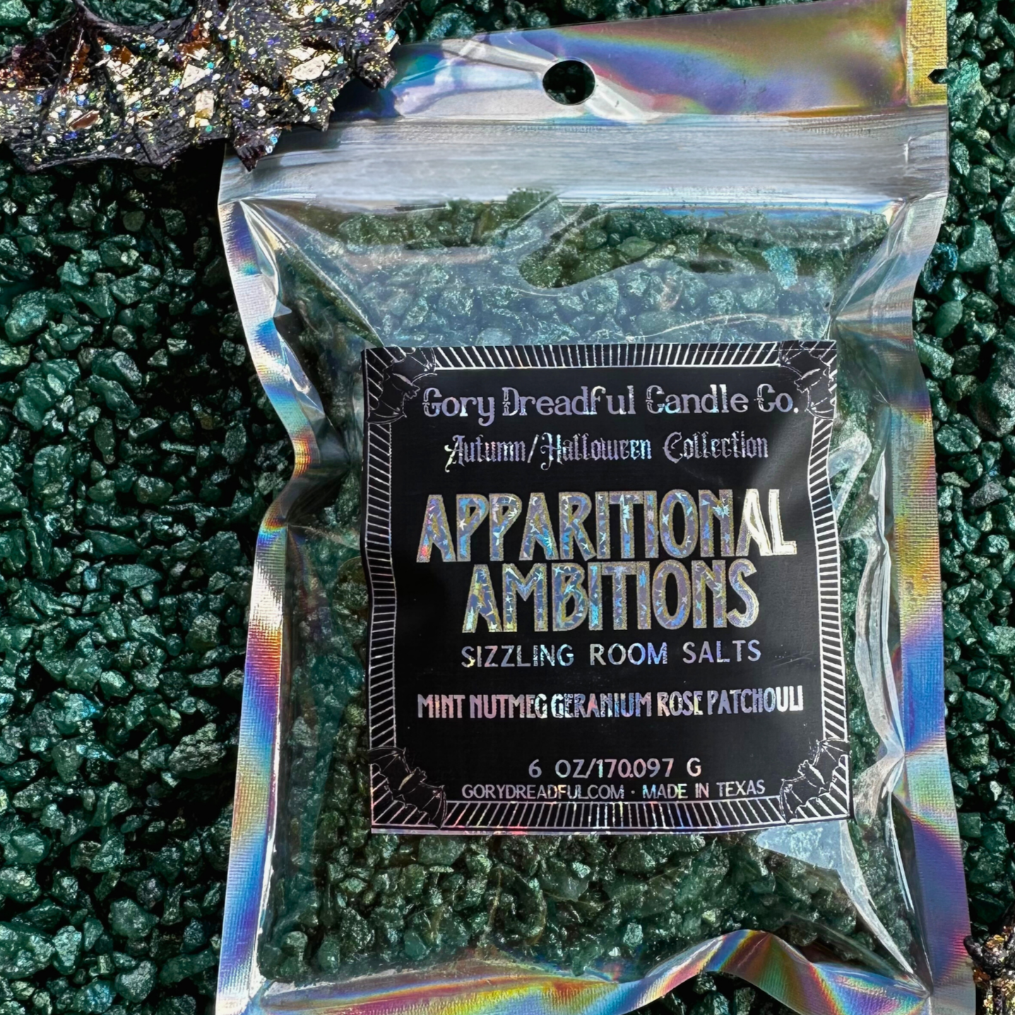 A package of 'Apparitional Ambitions' scented salt crystals by Gory Dreadful Candle Co. with holographic packaging, designed for use as potpourri.